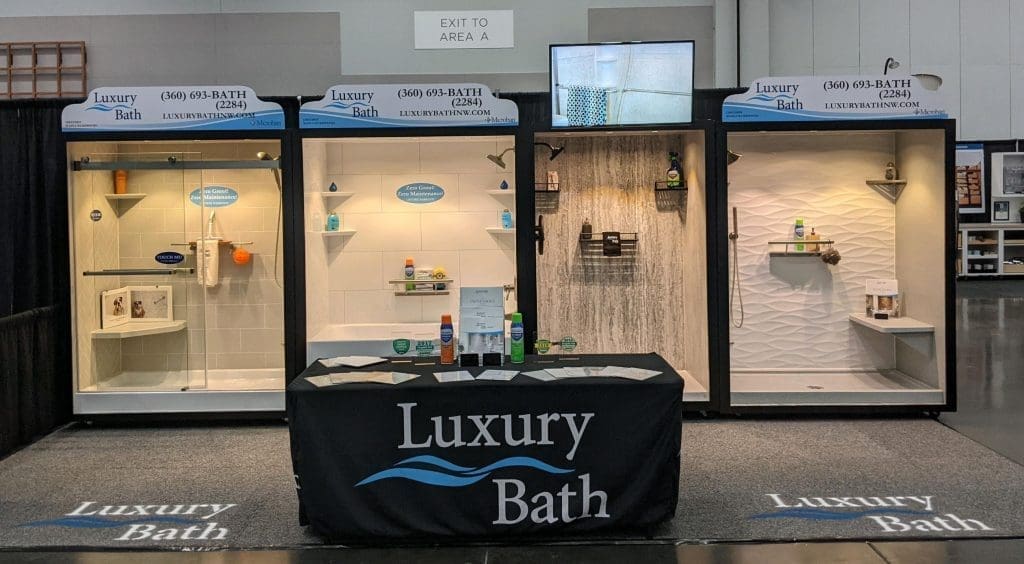 Luxury Bath exhibit with three illuminated bath and shower wall displays