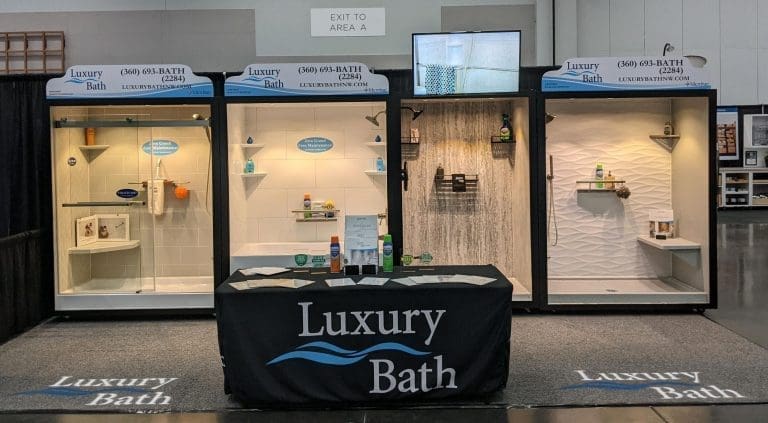 Luxury Bath exhibit with three illuminated bath and shower wall displays