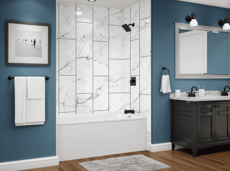 Modern bathroom with a white marble-look tub surround, blue walls, and dark vanity